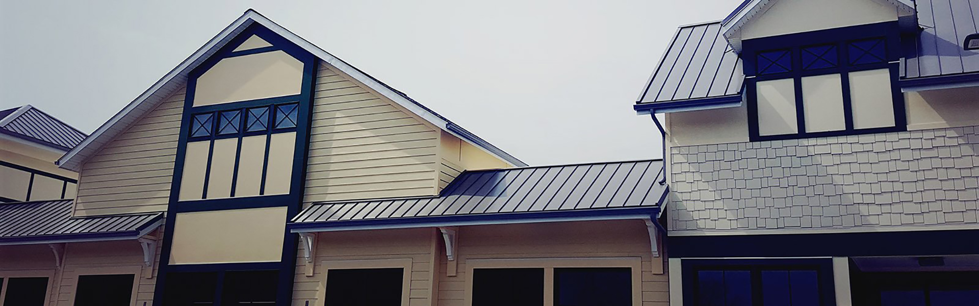 Wappingers Falls, NY building with a new Atas metal roof and James Hardie siding