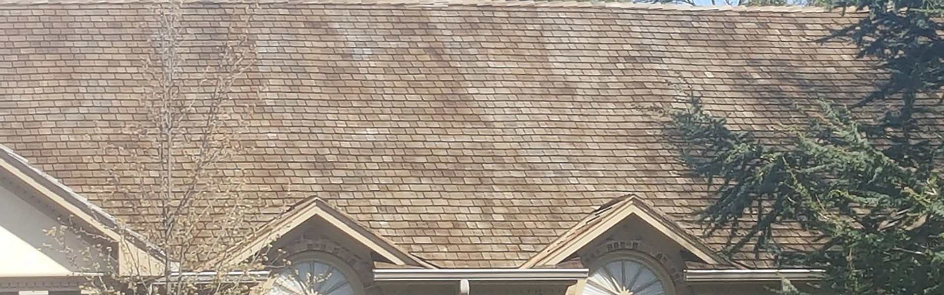 Saddle River, NJ home with a new cedar shake roof installed in 2012